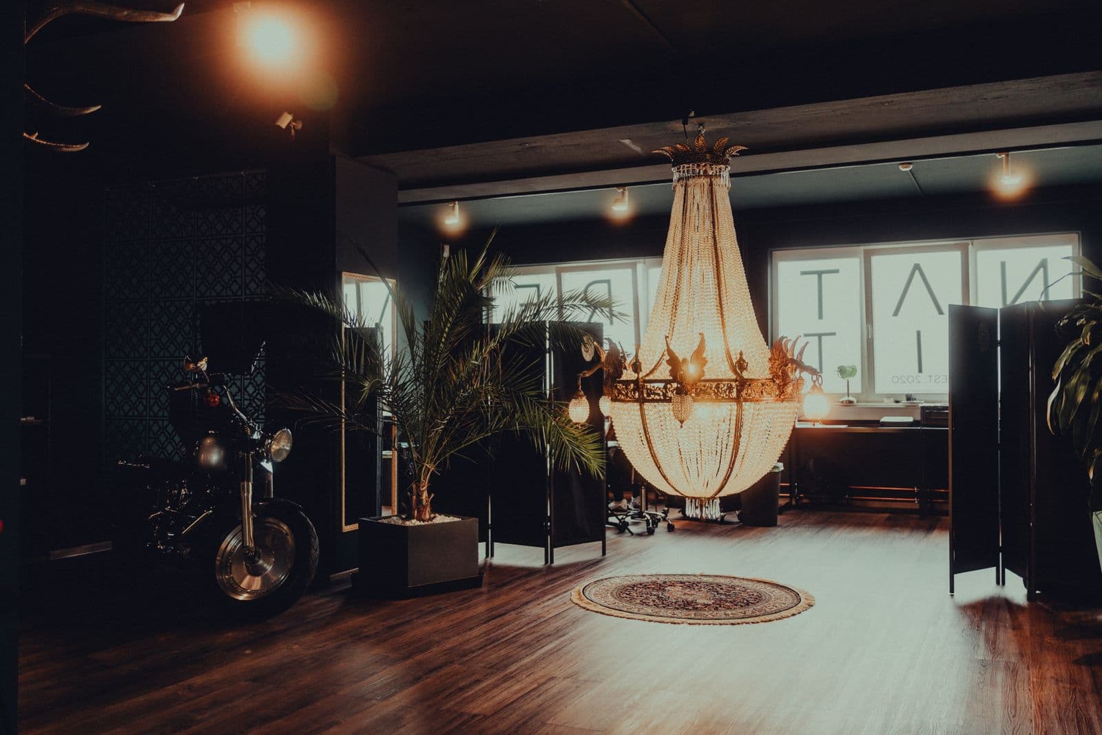 Studio floor with the chandelier and the shop bike